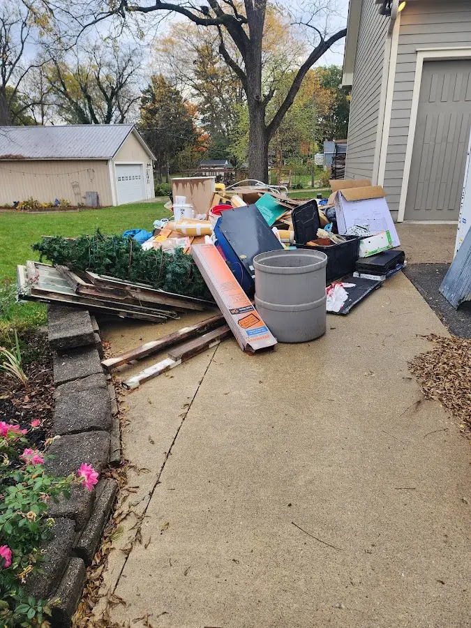 Dumpster being loaded with debris for Residential Dumpster Rental in Cape Canaveral